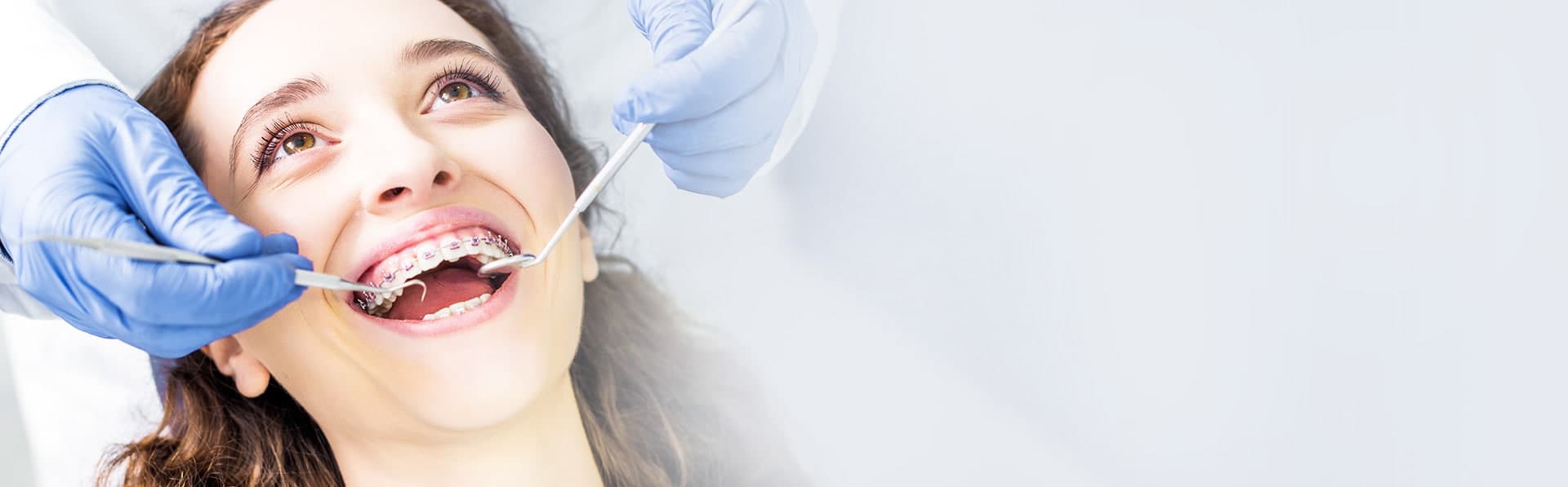 Dental professional crafting a smile model.